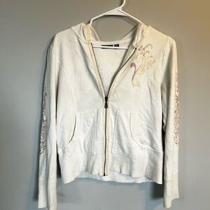 White zip up with pink designs.